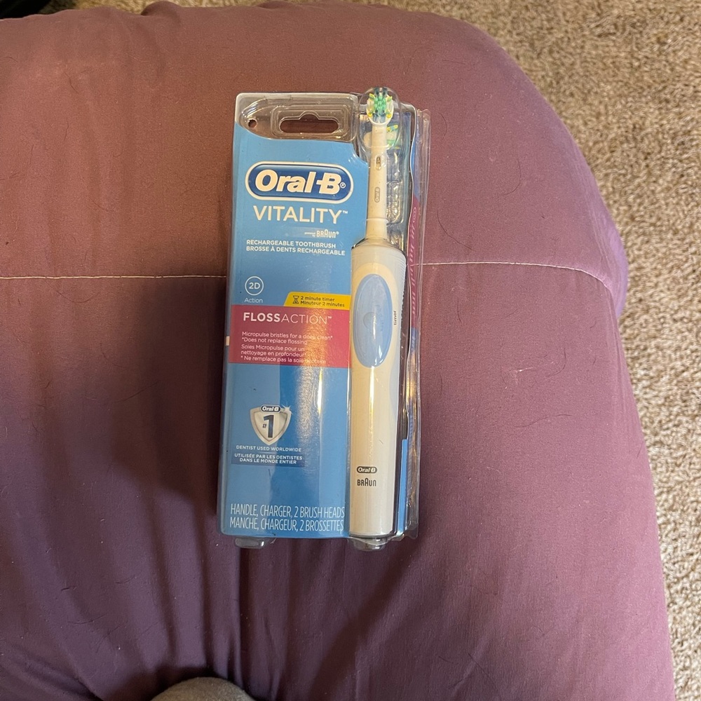 Oral B electric toothbrush in original packaging and has never been opened.